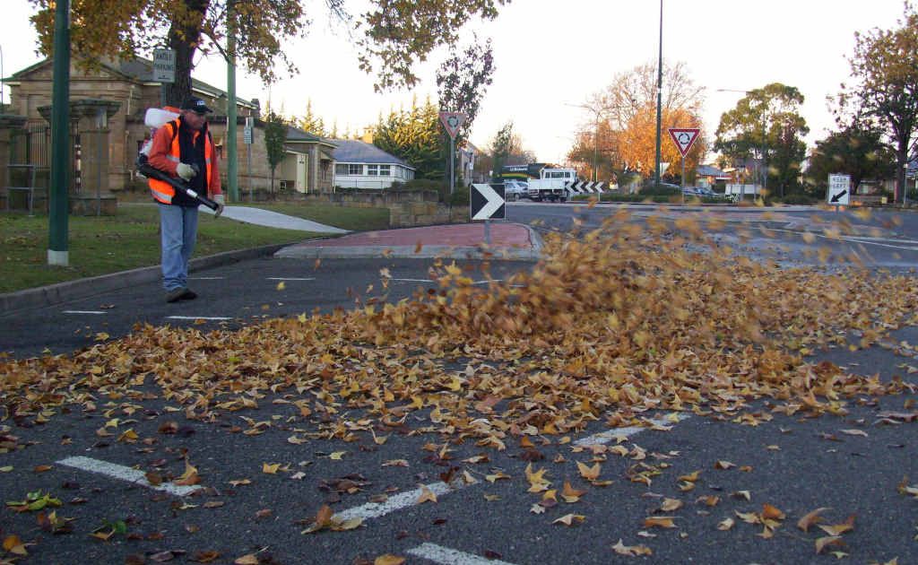 Council workers clean up the last of autumn leaves.